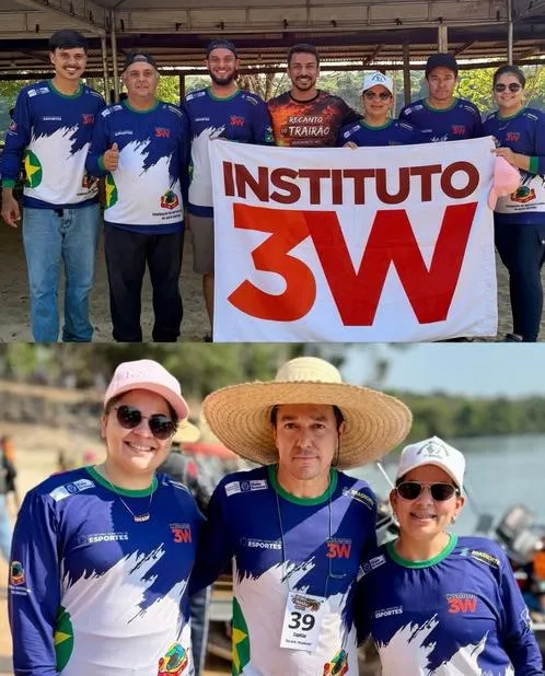 Equipe de pescadores com camisetas e bandeira do Instituto 3W.